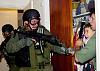Pictures of police and soldiers doing policey and soldiery things.-elian-gonzalez-934x.jpg
