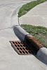 What do you guys use to store used oil?-curb_gutter_storm_drain.jpg